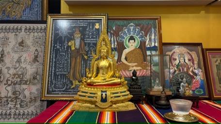 Sacred altar with Buddha statues and Thai yantra cloths