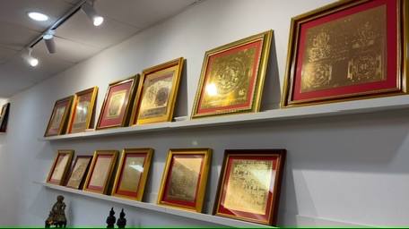 Framed gold yantras on wall